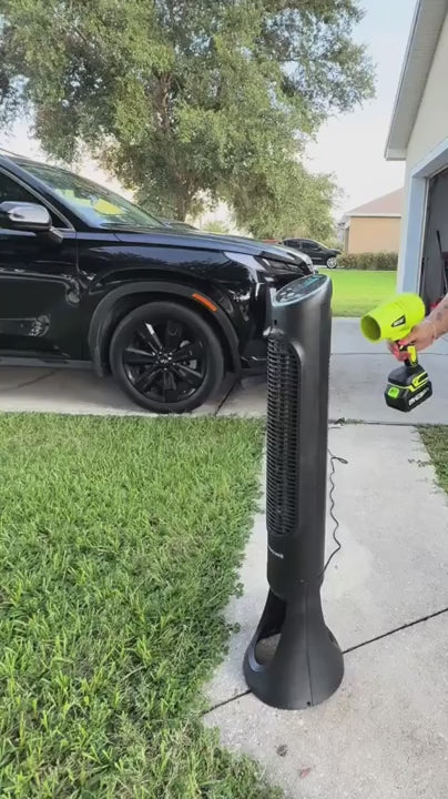 Leaf blower in use — driveway